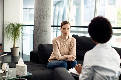 young-woman-having-meeting-with-psychologist-clinic